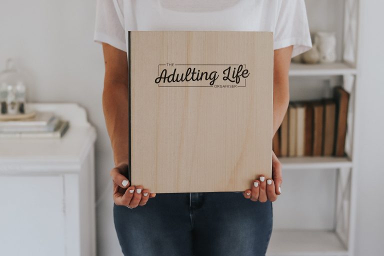 Lady holding the Adulting Life Organiser